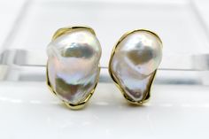 Item: K2EN3 Gemstone: Natural Baroque Pearl Material: Gold Plated, Silver 925 Both size are different mention total length Total length: 1) 2.8 x 1.8 cm                      2) 2.6 x 1.7 cm Weight :21.2 Gram Origin : Made in italy Pearl strengthens Moon (Chandra) in the wearer's horoscope. ... Pearl stone instills in its wearer positivity and courage and makes its wearer emotionally accessible, kind, and psychologically healthy. ... It is said that Pearl gemstone benefits people who are depresse Pear-shaped High Luster Earrings For Anniversary, Fine Jewelry Earrings With High Luster For Gifts, Sterling Silver High Luster Earrings For Anniversary, High Luster Sterling Silver Earrings For Anniversary, Mentally Disturbed, Pearl Christmas, Natural Pearl Earrings, Pearl Stone, Coral Pendant