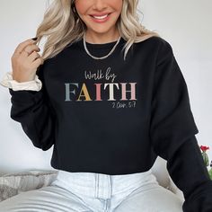 This Walk by Faith Sweatshirt is soft, stylish and comfy! Christian sweatshirts for women are a casual way to create conversations to share your faith. This Walk by Faith sweatshirt is versatile to wear for many occastions. Pair it with leggings for a casual style or wear it with jeans and layered necklaces for a classy casual fashion outfit. However you choose to wear it, Christian hoodies and sweatshirts are a great way to create opportunities to start conversations with anyone about your fait Inspirational Letter Print Sweatshirt For Fall, Inspirational Text Print Sweatshirt For Fall, Inspirational Text Print Fall Sweatshirt, Inspirational Graphic Print Sweatshirt For Fall, Inspirational Graphic Print Fall Sweatshirt, Fall Inspirational Graphic Print Sweatshirt, Create Opportunities, Christian Sweatshirts, Bold Faith