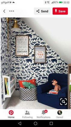 a child's room decorated in blue and white with animal prints on the wall