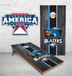 two cornhole game boards, one with the logo of the carolina bluebirds and another with the name of the team on it