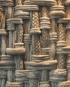 an up close photo of rope woven in different colors and sizes, as well as patterns