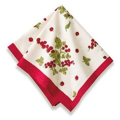 a white and red napkin with cherries on it