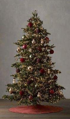 a christmas tree with red and gold ornaments