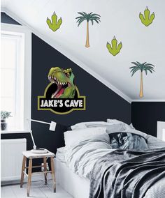 an image of a bedroom with a dinosaur sticker on the wall