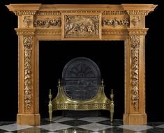 an ornate gold fireplace surround with black and white checkered flooring on the ground