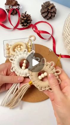 someone is making some ornaments out of yarn