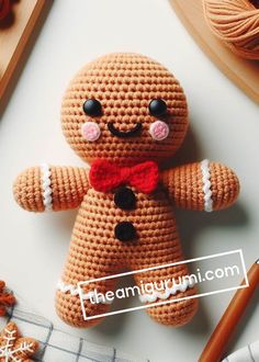 a crocheted ginger with a red bow tie