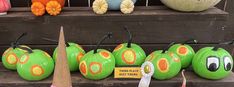 pumpkins with faces painted on them are for sale