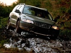 a car is driving through some muddy water