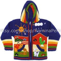 a child's blue jacket with colorful pictures on the front and back, featuring animals