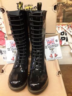 These are a now deleted model of Dr Martens boots. These 14 hole boots are finished in black Patent leather and have a heel that you'll find very comfortable too wear on a daily basis. They have a cushioned sole and footbed. They also have a side zip for ease of use. These are a UK size 5, European 38, ladies USA 7 Alternative Style Black Ankle Boots, Alternative Style Fitted Boots With Round Toe, Alternative Style Black Ankle Combat Boots, Alternative Black High Ankle Lace-up Boots, Fitted Knee-high Black Combat Boots, Alternative Style Black High Ankle Lace-up Boots, Black Fitted Knee-high Combat Boots, Fitted Black Knee-high Combat Boots, Black High-top Heeled Boots In Alternative Style