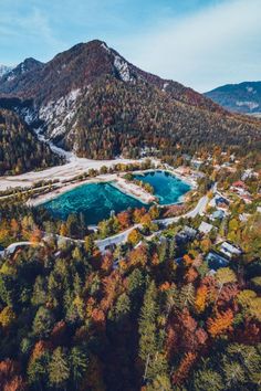 an aerial view of a lake surrounded by trees