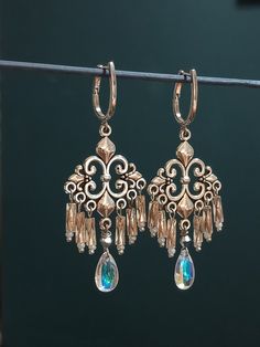 These dangle,chandelier Edwardian style earrings with blown glass beads are sure to nice accent any of your favourite style outfits and Victorian/Gothic wedding.  The earrings are packaged in a elegant gift bag prior to sending which will make this pair the ideal present whether it's for yourself or a loved one.  length 3 inches ( 7.5 cm) These are eye catching but airily looking! Thank you for visiting my shop! Victorian Chandelier Dangle Earrings With Intricate Design, Victorian Chandelier Earrings With Intricate Design, Elegant Teardrop Crystal Earrings With Dangling Beads, Victorian Filigree Chandelier Dangle Earrings, Victorian Dangle Chandelier Earrings For Parties, Victorian Chandelier Dangle Earrings For Party, Ornate Teardrop Chandelier Earrings Nickel Free, Ornate Teardrop Nickel-free Chandelier Earrings, Elegant Handmade Drop Chandelier Earrings