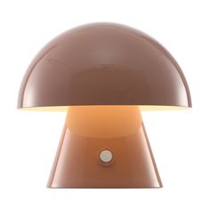 the mushroom lamp is brown and has a white light on it