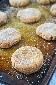 some sugary cookies are on a baking sheet