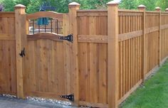 a wooden fence with the words take a look 4 ft yard fence on top of it