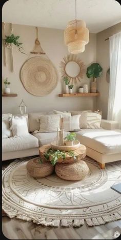 a living room filled with lots of white furniture and decor on top of a rug