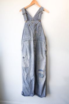 Vintage Big Smith Striped Repaired Overalls. Good condition with patches and repairs that lend to the overall style of the overalls. Light-wash railroad stripe overalls with straight leg and pockets. No marked content, feels like cotton, machine wash cold. No marked size, fits M/L best. Approx. Measurements: Waist: 19 1/2" Inseam: 28 1/2" Patched Overalls, Black Designs, Girly Fashion, Embroidered Silk, Raw Silk, Ulla Johnson, Embroidered Dress, Black Design, Favorite Things Gift