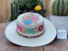 "This beautiful Mexican Hat is stylish and is completely unique in design, perfect to add that special touch to any outfit. This structured palm hat is often referred to as a women \"boater\" hat with its flat crown. The wide brim is accented by a hand painted band. The hat itself is made out of high quality jute and is very light and breathable. It is handmade and hand painted by Mexican Artisans in Mexico." Gold Embroidered Dress, Mexican Hat, Nice Sandals, Painted Hats, Floral Hat, Boater Hat, Mexican Party, Traditional Mexican, Mexican Wedding