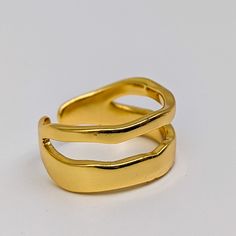 This is a ring that will make you stand out in the crowd. In a curved shaped design worn on its own makes a statement and can be paired with other rings design in our collection for a significant impact.  One size: Adjustable Colour: Gold  Material: 18 Carat gold-plated Alloy (Lead and Nickel free) Diameter: 1.65cm Width 0.92cm Shop more on our website at www.zilakjewellery.com Jewellery Care Keep your jewellery away from moisture including alcohols such as perfume or sanitisers. Always remove y Bridesmaid Ring, Bridesmaid Rings, Stainless Steel Ring, Minimalist Ring, Minimalist Rings, Jewelry Cleaner, Dainty Ring, Stainless Steel Rings, Steel Ring