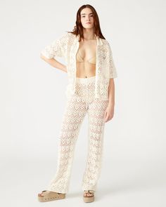 Introducing the EDDIE pant, featuring a delicate lace crochet design. These wide leg pants offer a unique blend of style and comfort, and are perfect as a beach coverup or as festival-wear. Wide leg open crochet pants Inseam: 29.5" 100% cotton Hand wash Shop the set here Liv is 5ft 9in and is wearing a size small Imported Graduation Look, Crochet Pants, Jumpsuit And Blazer, Blazer And Skirt, Crochet Design, Cargo Skirt, Yoga Fashion, Lace Crochet, Bottom Clothes