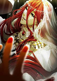 a woman with red hair and white dress holding her hand up in front of her face