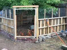 a chicken coop with chickens in it