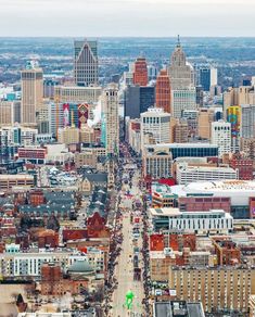 an aerial view of a city with tall buildings