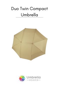 an umbrella is shown with the words duo twin compact umbrella in white and tan colors