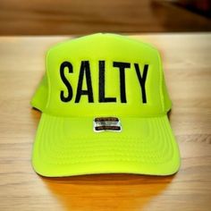 Salty embroidered on your favorite color Otto Foam High-Profile Trucker Hat. How to Order: 1. Choose the color hat  2. Pick the color of thread   Message us with any questions Hat Description:  The Traditional Look 5-panel cap Seamless Foam Front Panel with Lining Matching Color Braid Visor Matching Fabric Undervisor, Adjustable Snapback SHAPE: High-Profile FABRIC:  100% Polyester Front,  Mesh Back VISOR: Pre-curved FIT & SIZE: OSFM - Adult (6 1/2 - 7 5/8) Youth Size (6 - 7 1/8) STRUCTURED Adjus Casual Beach Snapback Hat With Letter Print, Casual Sun Hat With Letter Print For Beach, Casual Beach Sun Hat With Letter Print, Casual Letter Print Sun Hat For Vacation, Casual Beach Trucker Hat With Letter Print, Casual Trucker Hat With Letter Print For Beach, Casual Snapback Hat With Letter Print For Vacation, Vacation Snapback Baseball Cap With Letter Print, Trendy Sun Hat With Letter Print For Beach