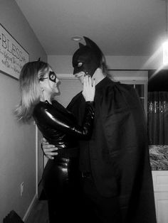 two people dressed up as batman and catwoman