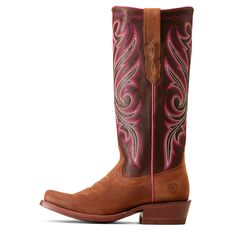 a pair of cowboy boots with pink and brown accents on the bottom, side view