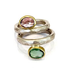 Pink and Green Tourmaline Ring Set, Stacking Gemstone Rings, Solid Gold and Silver Stacking Rings Beautiful set of pink and green Tourmaline gemstones, set in solid 18k gold on sterling silver hammers bands. This ring set has a great charm, wearing both rings with the stones opposite each other. One beautiful pastel rose color opposite a mint green - very unusual look, perfect for a sophisticated office look or an elegant night out. Details - * Sterling silver. * 18k solid gold. * Silver band - Fusion Style Green Rings With Accent Stones, Green Fusion Style Rings With Accent Stones, Green Fusion Rings With Accent Stones, Unique Pink Tourmaline Rings, Green Oval Fusion Rings, Unique Pink Multi-stone Rings, Unique Green Tourmaline Rings, Rings Beautiful, Sophisticated Office