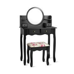 a black vanity table with a mirror and stool in front of it on a white background