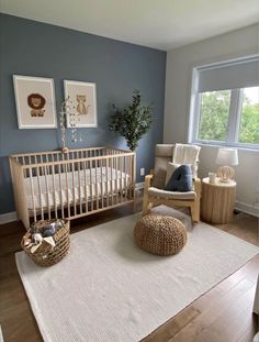 a baby's room with a crib, rocking chair and rug in it