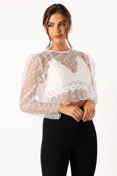 DETAILS
The lace shirt design adds a touch of femininity, while the high round neckline elongates your neck and accentuates. The functional button closure allows you to feel comfortable all night long, giving you the perfect fit every time.


lace shirt style
high round neckline
long sleeve

scalloped hemlines
button close
unlined


material - 100% polyester









SIZING

model is 5' 7" and wears a Size S
model stats: bust - 33", waist - 27", hips - 36"















GARMENT CARE

cold hand Sheer Sleeves Lace Top For Night Out, Party Mesh Top With Lace Trim, Sheer Sleeves Lace Top For Party, Lace Top With Sheer Sleeves For Party, Party Long Sleeve Tops With Lace Trim, Long Sleeve Lace Trim Party Tops, Night Out Blouse With Lace Patchwork, Lace Blouse With Patchwork For Night Out, Scalloped Lace Tops