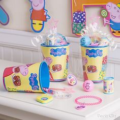 peppa pig birthday party supplies on a table