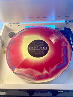 Picture of the vinyl punisher by Phoebe Bridgers on a record player. The record itself is the font explosion pricing side, a a marbling of red and yellow colors. Punisher Vinyl Phoebe, Phoebe Bridgers Vinyl, Punisher Vinyl, Phoebe Core, Pump Organ, Baritone Guitar