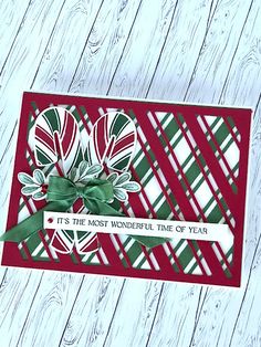 a close up of a greeting card on a table with wood planks in the background