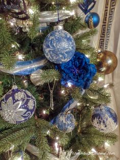 a blue and white christmas tree with ornaments