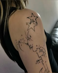 a woman's arm with stars on it and writing below the arm tattoo design