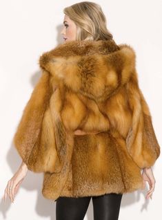 This luxurious fox fur cape maintains its naturally beautiful red color. It has a gorgeous hood, cropped sleeves, leather inserts and a detachable leather belt for a flattering fit. This item is one of a kind, one size fits most. This fur is custom-made, please allow approximately two weeks turnaround time. *This style is custom-made, please allow approximately 2-6 weeks for delivery. For questions or rush orders, please use our chat or call 334-277-7610. SKU: 2110-358052 Fur Origin: Finland Mad Luxury Hooded Fox Fur Coat, Luxury Fox Fur Mink Outerwear, Luxury Faux Fur Cape Coat, Luxury Fox Fur Coat With Faux Fur Trim, Luxury Fox Fur Outerwear In Mink, Cape With Hood, Fur Cape, Cropped Sleeves, Naturally Beautiful