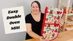 a woman holding up an oven mitt with the words easy double oven mitt