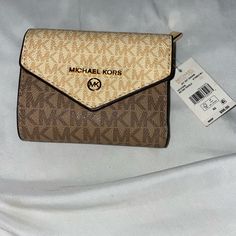 Micheal Kors Trifold Wallet. Still Has Tags And Care Card. Originally $98 But Asking For $65. Never Been Used Compact Beige Bags With Card Slots, Compact Beige Bag With Card Slots, Compact Beige Wallet With Interior Card Slots, Beige Envelope Wallet With Card Slots, Compact Beige Wallet With Card Slots, Beige Bifold Wallet With Card Slots, Cream Bifold Wallet With Interior Card Slots, Beige Envelope Wallet For Everyday Use, Everyday Beige Bifold Wallet