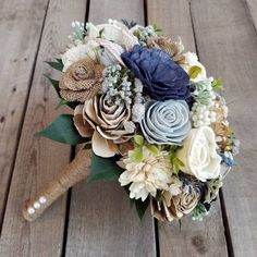 a bridal bouquet with blue and white flowers