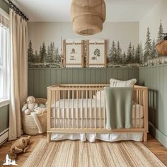 a baby's room with a crib, rugs and pictures on the wall