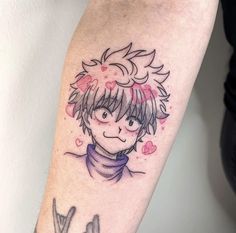 a person with a tattoo on their arm that has an image of a boy in the background