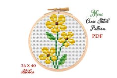 a cross stitch pattern with yellow flowers on it