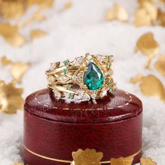 a green ring sitting on top of a wooden box