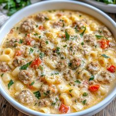 a white bowl filled with pasta and meat